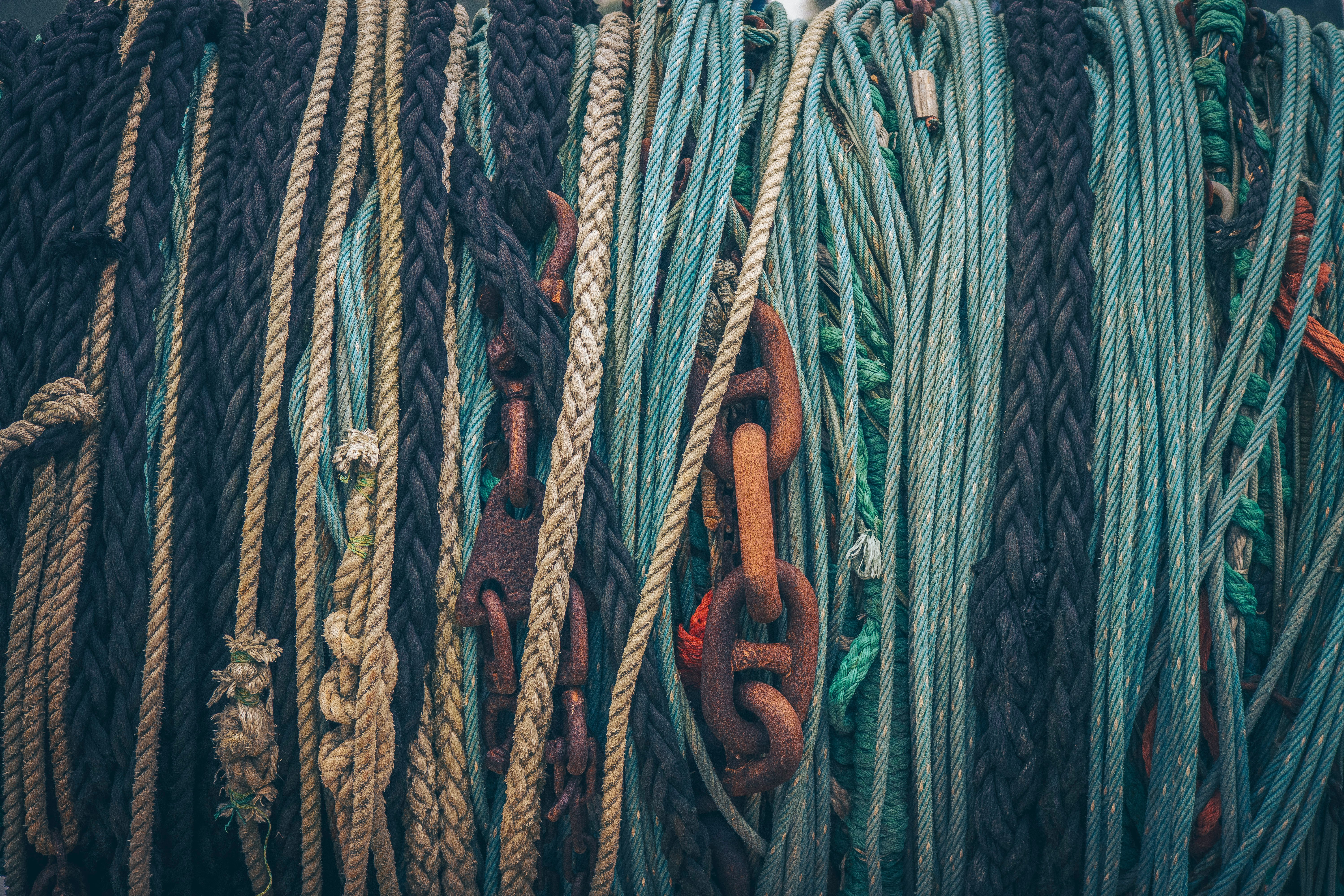 blue and white rope on brown metal bar